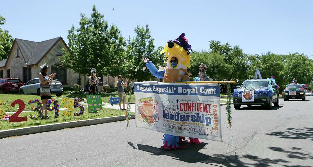 Anna Wimberley, dressed as Yata the Pinata, the mascot of Fiesta Especial, leads a parade down West Magnolia Avenue on Sunday, April 26. It was. the grand finale of the Fiesta Especial Royal Court’s check presentations to local nonprofits. The young members of the court raised nearly $40,000 this year.