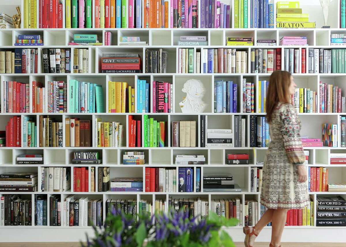 This wall of bookshelves was created for homeowners who are voracious readers and own a major book collection.