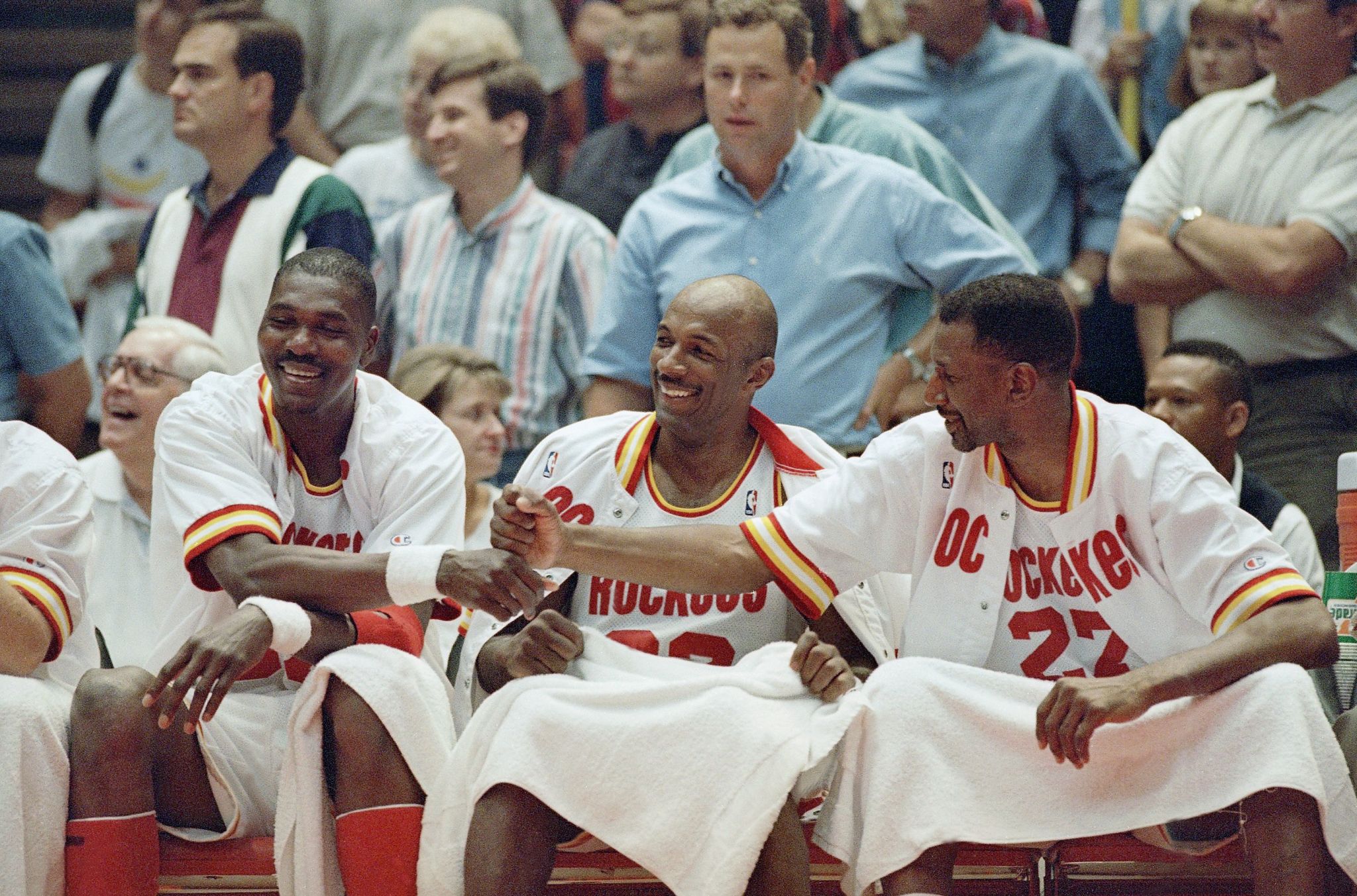 Hakeem Olajuwon of the Houston Rockets on the bench during a regular