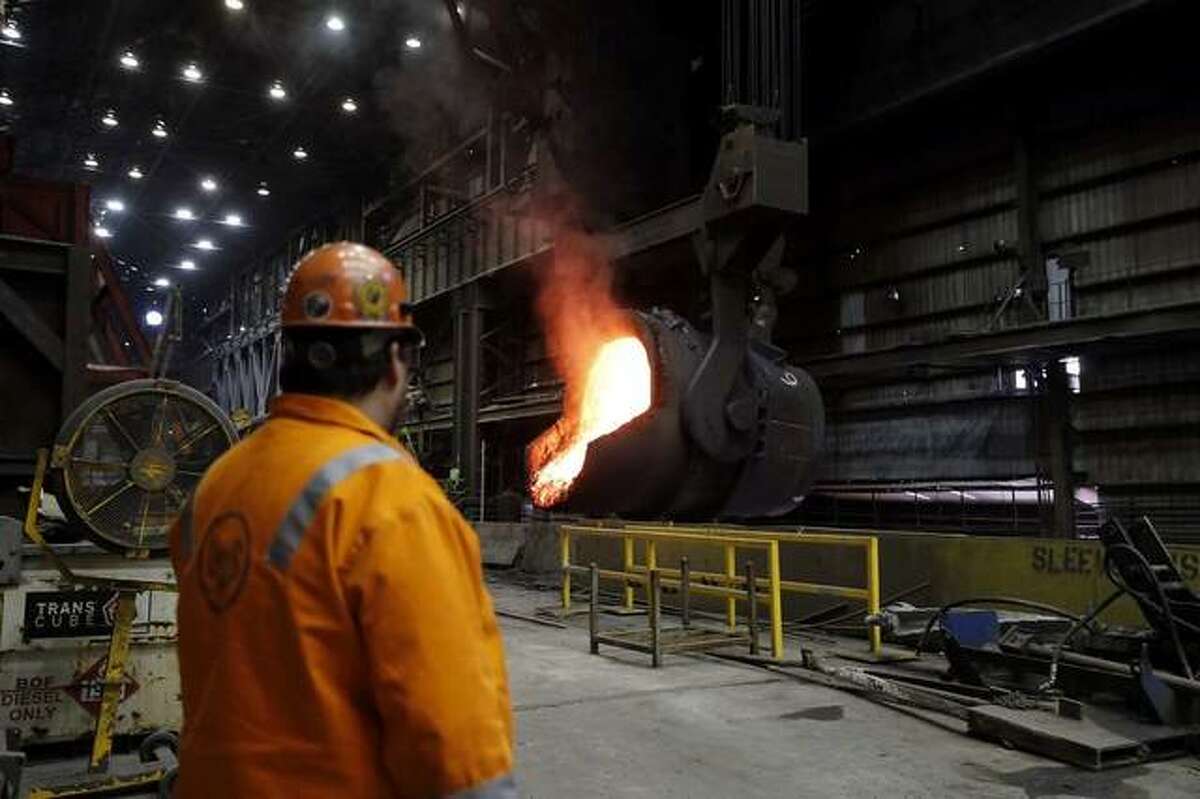 In thsi 2018 file photo, Randy Feltmeyer checks a giant ladle that has poured red-hot iron into a vessel in a furnace at the U.S. Steel Granite City Works plant in Granite City. A Worker Adjustment and Retraining Notification Act notice filed Friday by U.S. Steel said the company may lay off as may as 737 workers at the factory.