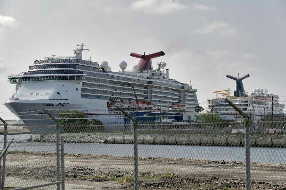 FILE - In a Thursday, March 26, 2020 file photo, Carnival Cruise ships are docked at the Port of Tampa in Tampa, Fla. Carnival Cruise Lines says it plans to gradually resume cruising in North America in August, nearly five months after it halted operations due to the new coronavirus. Sailings will begin on Aug. 1 with eight ships setting off from Galveston, Texas; Miami; and Port Canaveral, Florida. (AP Photo/Chris O'Meara, File)