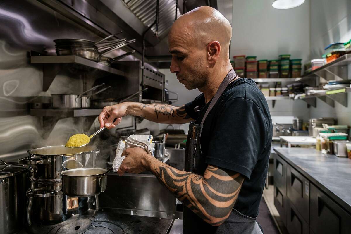 Mourad Lahlou prepares couscous in the kitchen of Aziza, his new Moroccan restaurant in San Francisco, Calif., on Sunday, December 1, 2019.