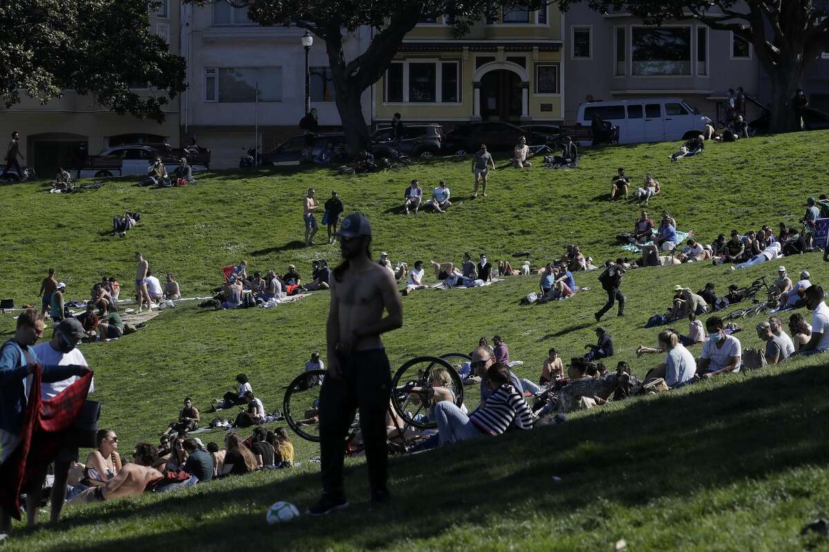 People relax at Dolores Park in San Francisco on Sunday, May 3, 2020, during the coronavirus outbreak.