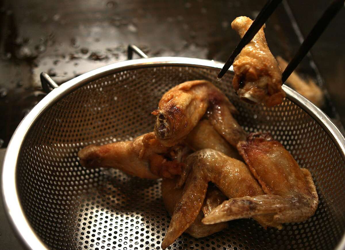 Chicken wings coming out of the deep fryer at Izakaya Sozai in San Francisco, Ca., on Friday, September 2, 2011.
