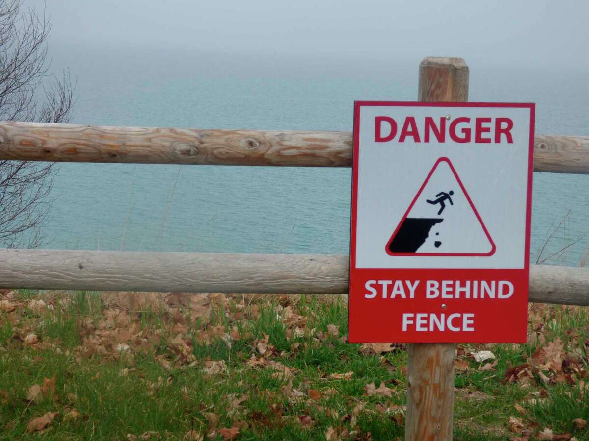 PHOTOS Manistee Lake docks underwater, rain on the way