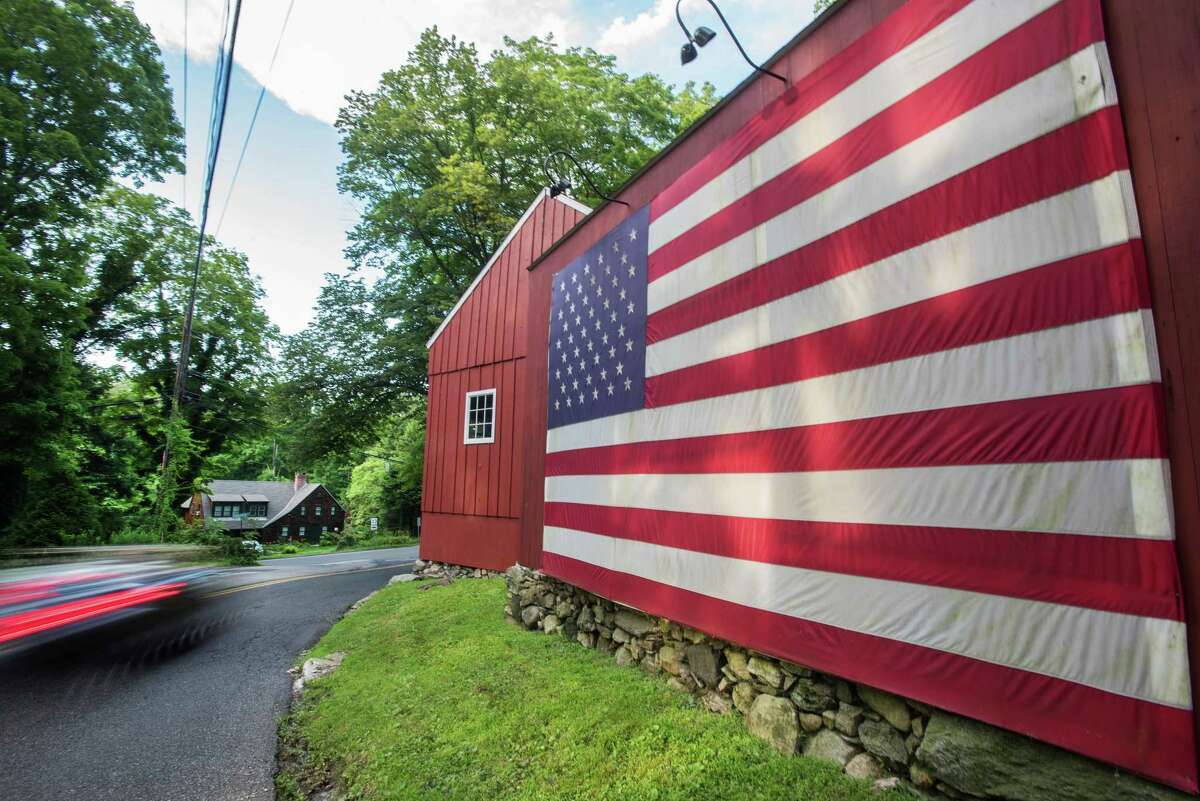 This flag on Belden Hill Road in Wilton last year was a reminder of reminder Independence Day in Wilton and a day of town-wide celebration.