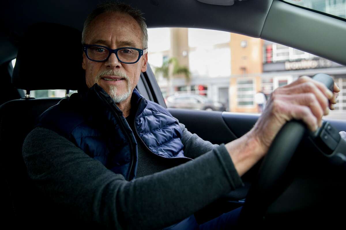 Lyft driver Steven Smith poses for a portrait as he waits to get a call from a passenger in San Francisco, Calif. Thursday, March 19, 2020. Smith and other Lyft drivers have seen a decline in ridership amidst the Bay Area's shelter-in-place in response to the global outbreak of the Coronavirus.