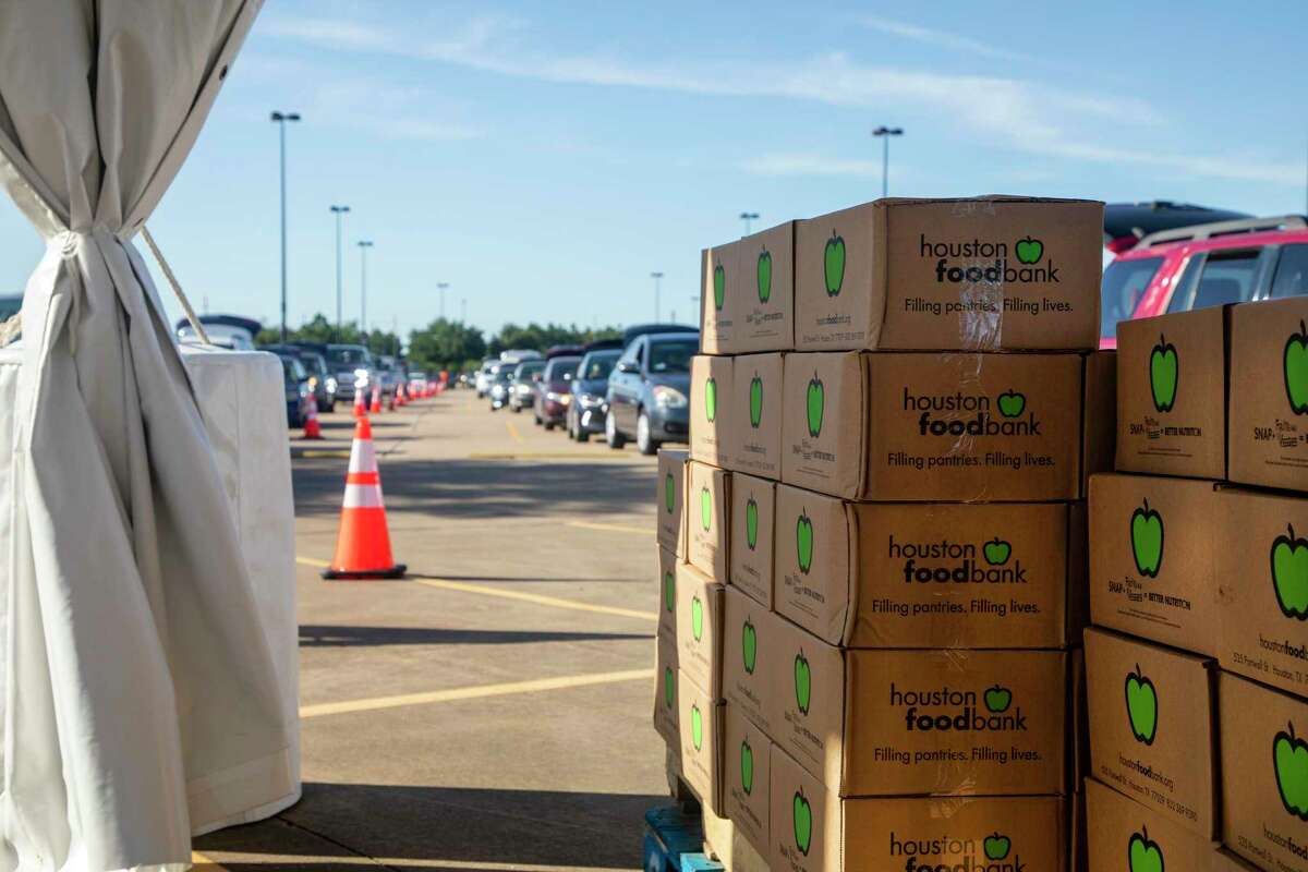 Cars lined up at the Berry Center in Cypress on April 29, 2020, for boxes prepared by the Houston Food Bank.
