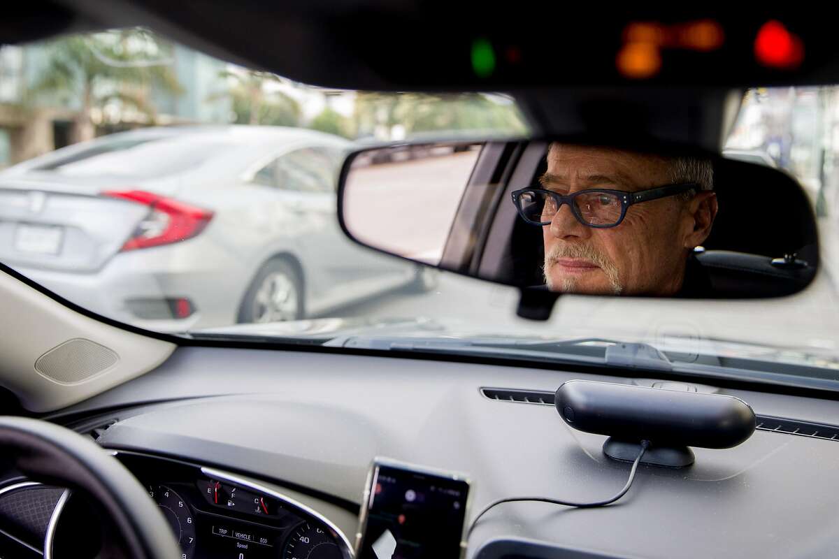 Lyft driver Steven Smith waits to get a call from a passenger in San Francisco, Calif. Thursday, March 19, 2020. Smith and other Lyft drivers have seen a decline in ridership amidst the Bay Area's shelter-in-place in response to the global outbreak of the Coronavirus.