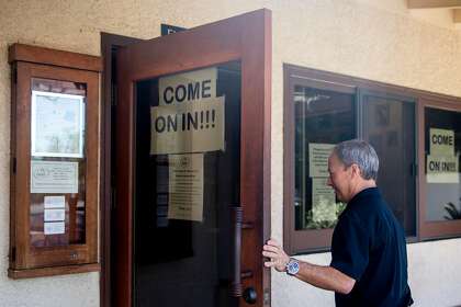 Fume Bistro owner Terry Letson enters his restaurant in Napa, Calif. Tuesday, May 5, 2020. A handful of businesses in Napa have made the decision to begin reopening their dining rooms at a limited scale ahead of shelter-in-place orders.