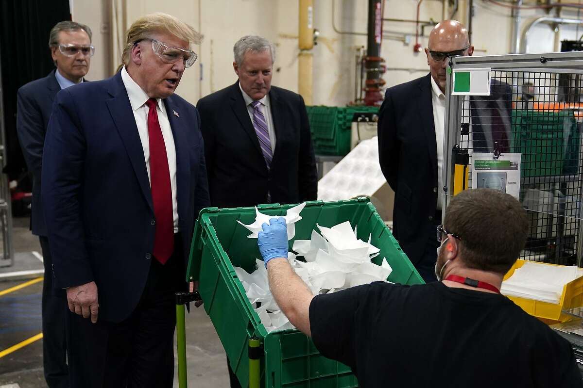 President Donald Trump participates in a tour of a Honeywell International plant that manufactures personal protective equipment, Tuesday, May 5, 2020, in Phoenix. (AP Photo/Evan Vucci)
