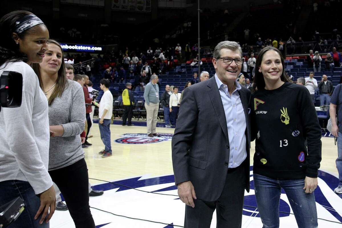 STORRS, CONNECTICUT- FEBRUARY 13: Former players Caroline Doty and Maya Moore watch head coach Geno Auriemma of the Connecticut Huskies with Sue Bird after the UConn Huskies one hundredth consecutive win during the UConn Huskies Vs South Carolina Gamecocks NCAA Women's Basketball game at Gampel Pavilion, on February 13th, 2017 in Storrs, Connecticut. (Photo by Tim Clayton/Corbis via Getty Images)