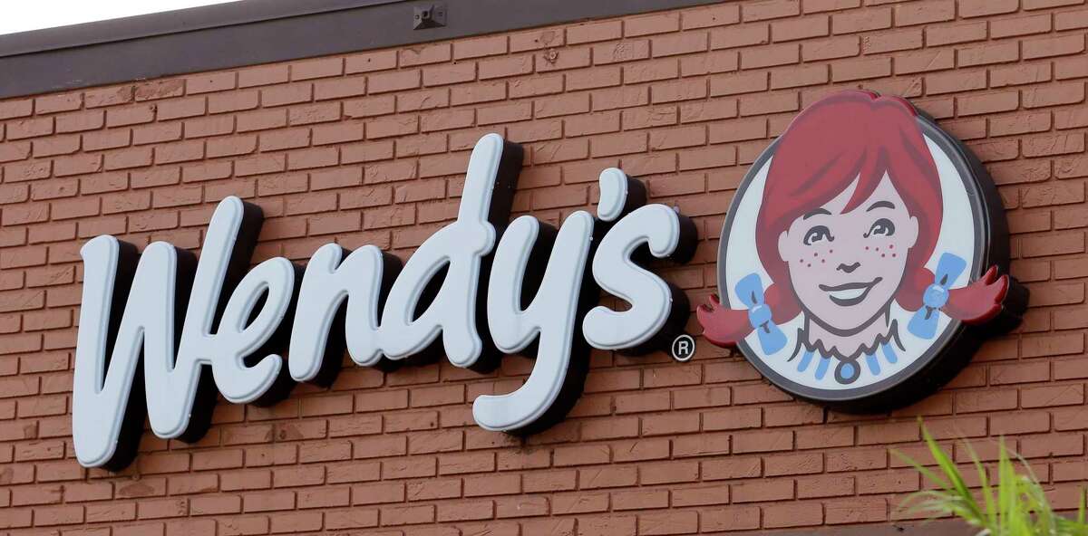 FILE - This Aug. 11, 2017 file photo shows a Wendy's sign at a restaurant in Miami. U.S. meat supplies are dwindling due to coronavirus-related production shutdowns. As a result, some stores like Costco and restaurants like Wendy's are limiting sales. U.S. beef and pork processing capacity is down 40% from last year. On Monday, May 4, 2020 nearly 20% of U.S. Wendy's didn't have beef available on their online menus, according to an analysis by Stephens, an investment bank. Wendy's confirms it's seeing temporary shortages. (AP Photo/Alan Diaz, file)