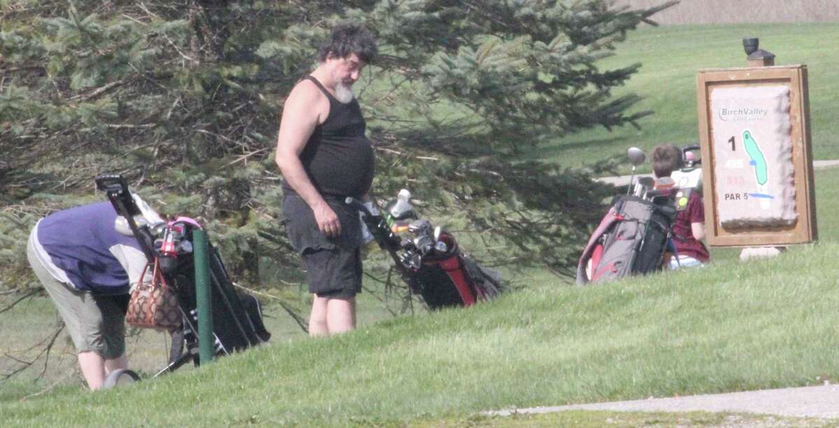 Golfers prepare to tee off at Evart's Birch Valley Golf Course on Saturday. (Herald Review photo)