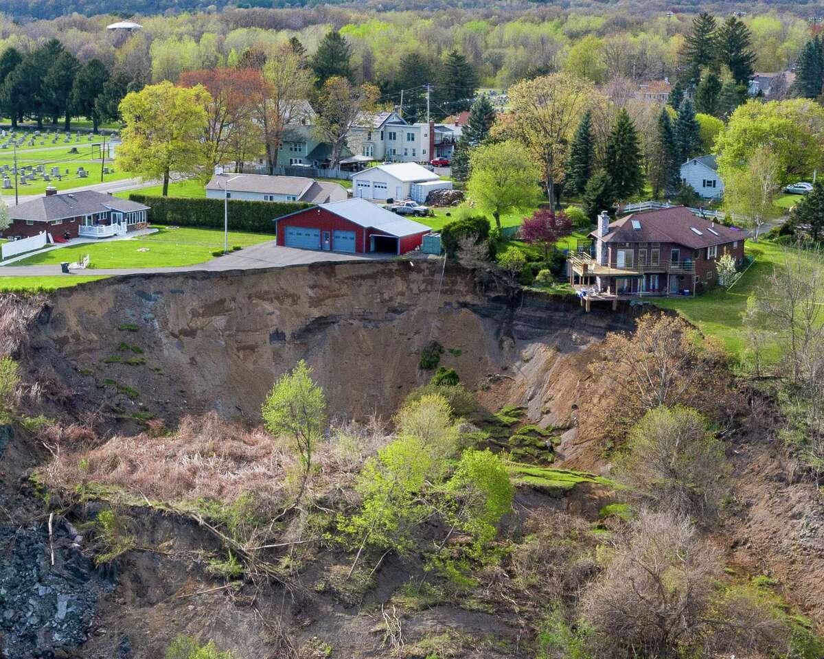 Aerial view of the Middletown Road landslide on Tuesday, May, 5, 2020, in Waterford, N.Y. This home is on the edge of a large, sloping hill gave way on Sunday dropping about 150 feet into a pond below. (Jim Franco/Special to the Times Union)
