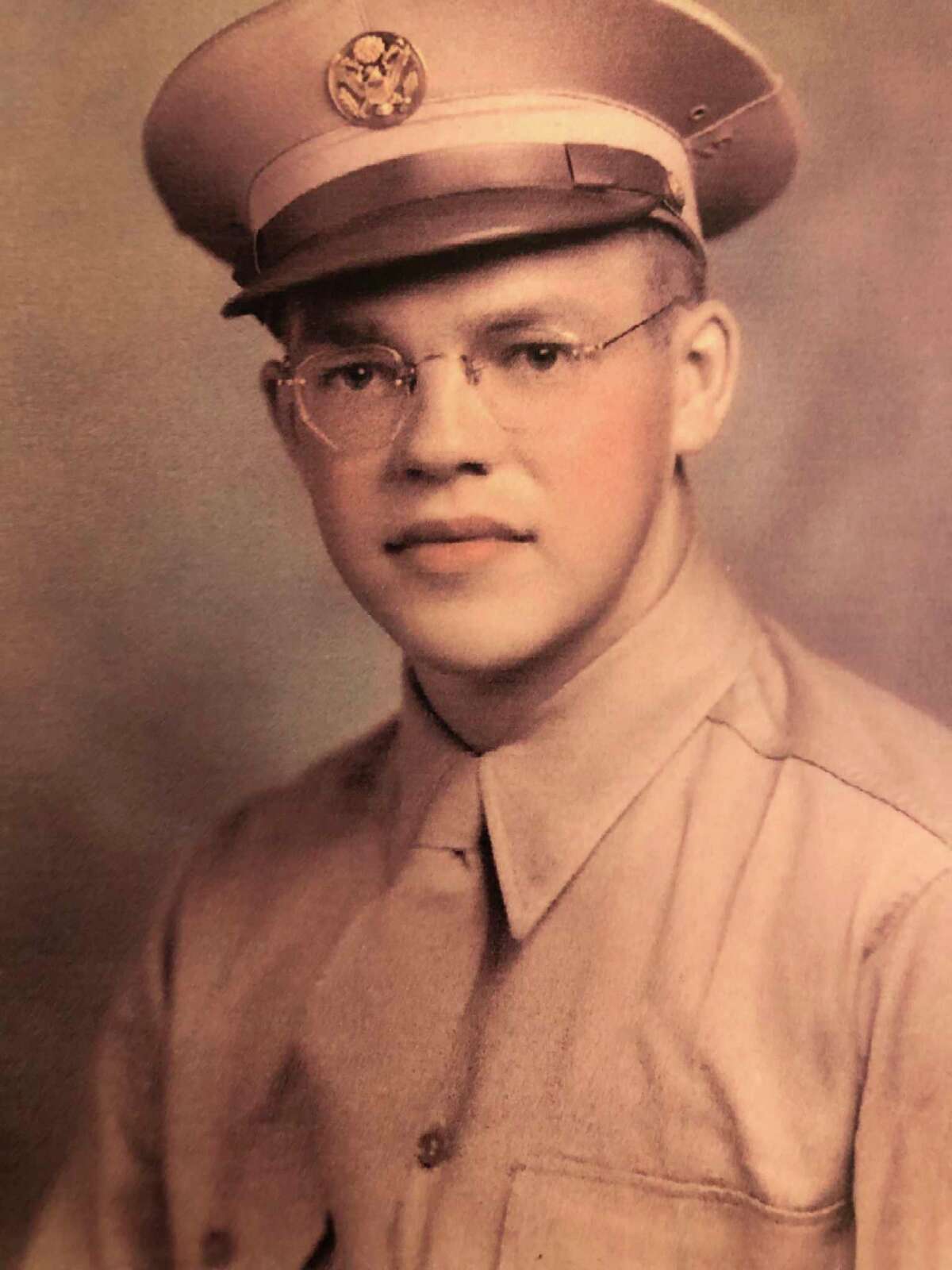 This is Gale Dickinson as he looked at 20. His mom and dad and his pastor saw him off on the Greyhound bus that took him to Fort Custer, Michigan. His pastor gave him a copy of the New Testament and Gale carried it with him all through World War II. (Photo provided)