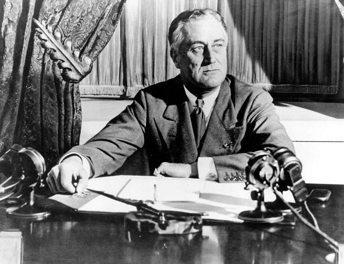 President Franklin D. Roosevelt delivers his first radio “fireside chat” in Washington in March 1933.