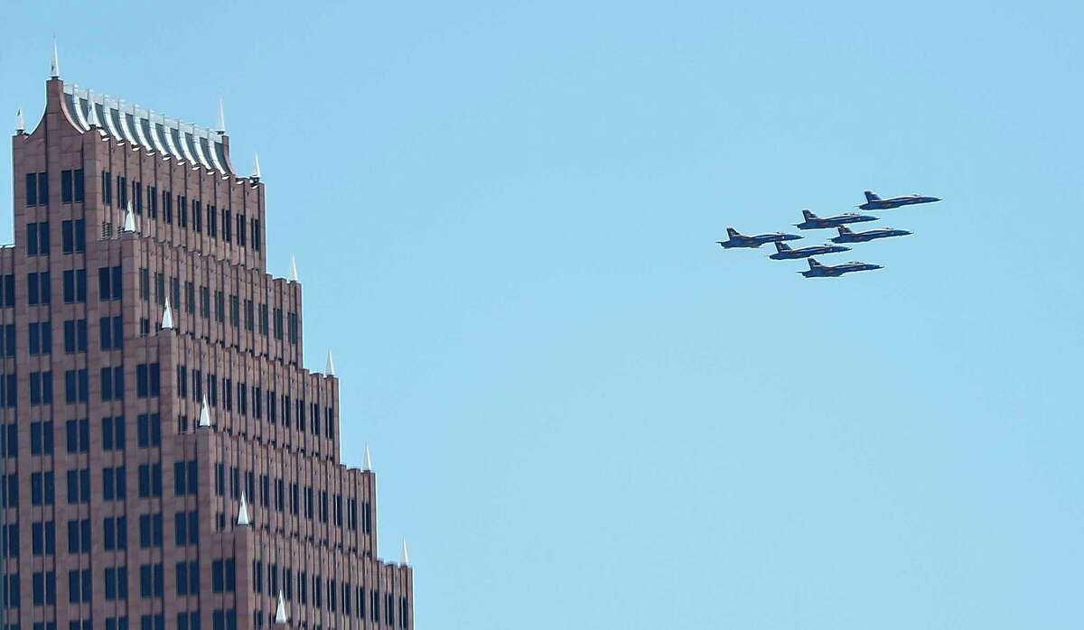 The Blue Angels' America Strong flyover passes the Bank of America building in Houston, Wednesday, May 6, 2020. Photographed from the top deck of Skyhouse Houston on Main Street. The 30-minute flyover was a salute to frontline COVID-19 responders.