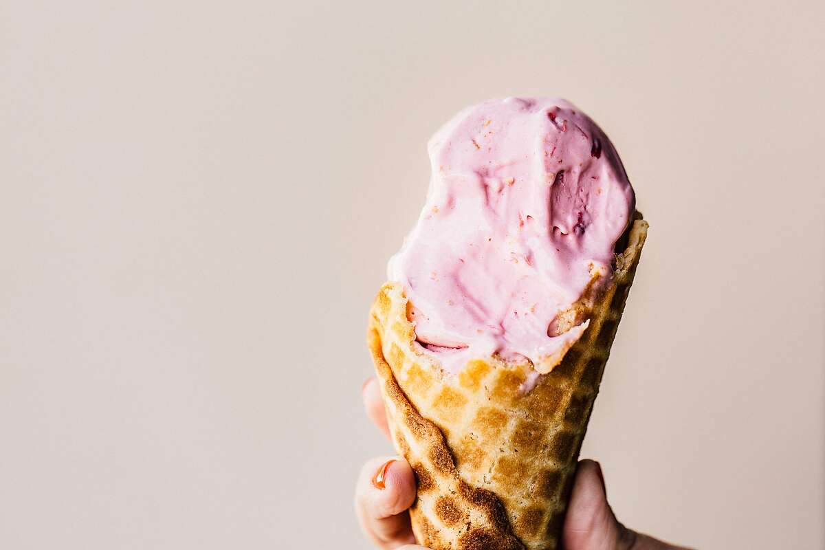 A cone of strawberry ice cream made with Perfect Day’s base, as seen from Smitten Ice Cream.