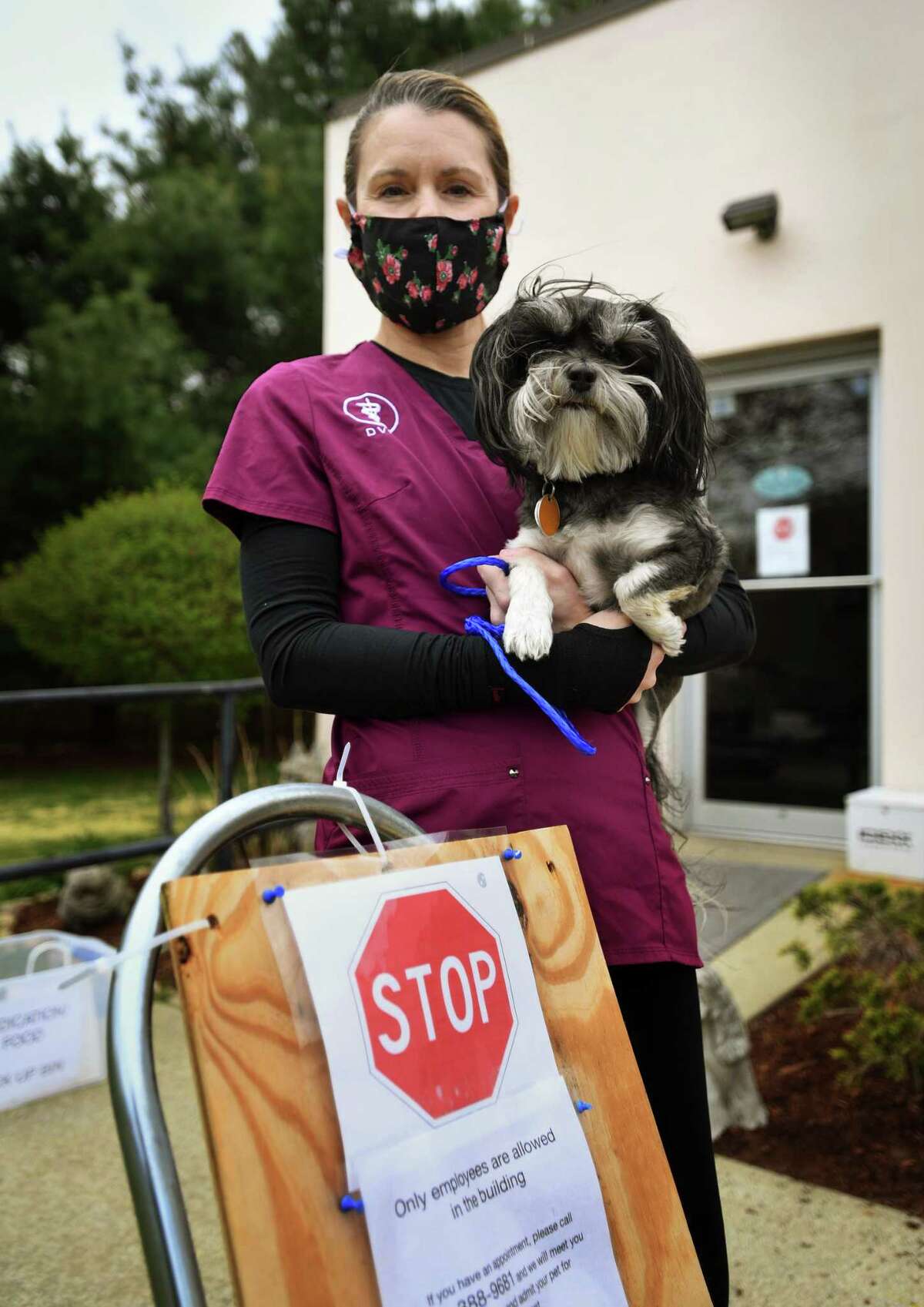 Veterinarian Suzanne Magruder, DVM, owner of Saybrook Veterinary Hospital, with her dog Dexter in Old Saybrook, Conn. on Wednesday, May 6, 2020.