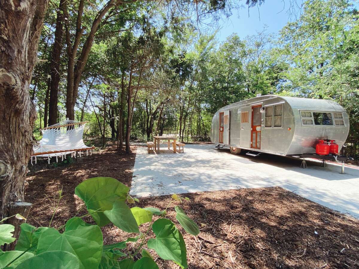 Situated along 30 scenic acres surrounded by creeks, hiking trails and lush greenery, the outdoor resort offers six vintage Airstreams for rent and 15 sites for guests to bring their own trailers. Each site has private parking and wooden tables and benches.