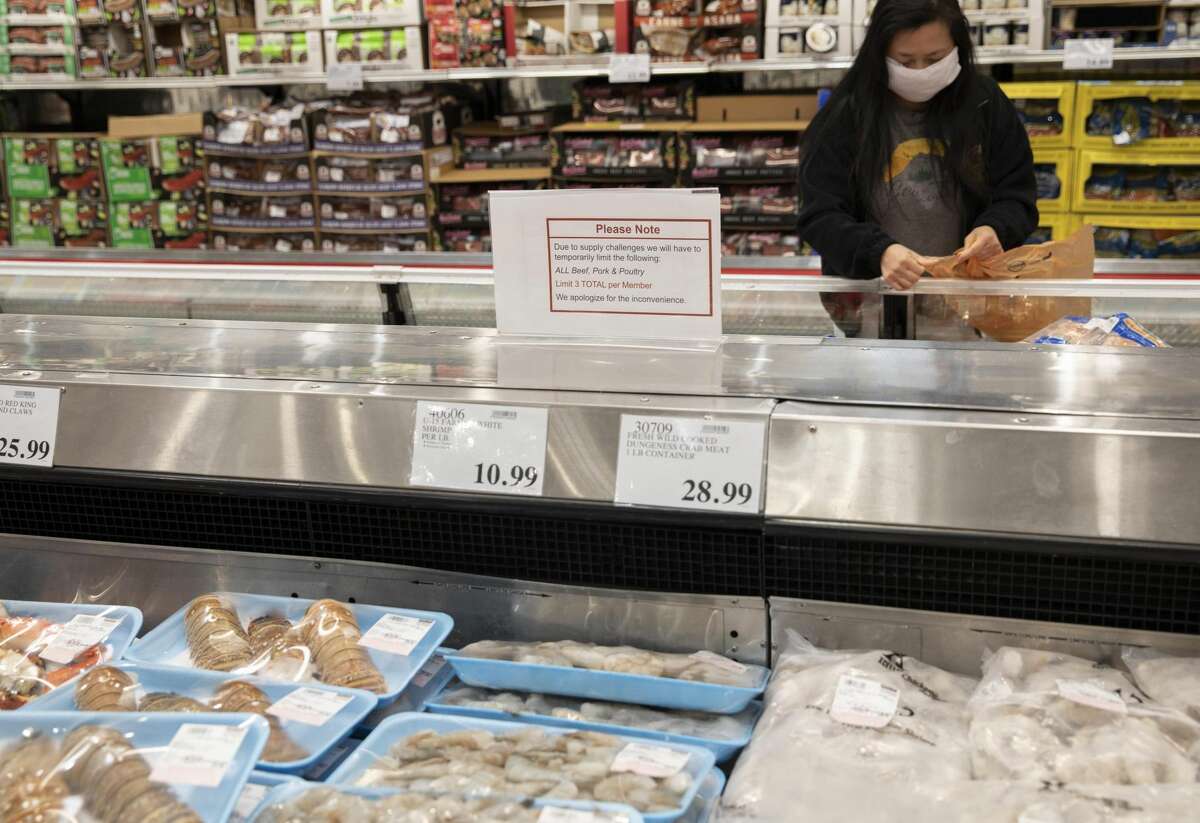 A customer purchases at a supermarket in San Francisco Bay Area, the United States, May 3, 2020.