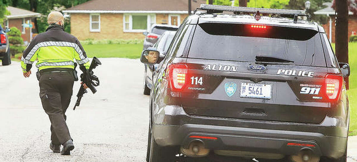 Alton Police were taking no chances Tuesday as they searched for the fleeing home invasion suspect, at first unsure which direction he had ran, from the Porter Street house where the alleged home invasion took place.