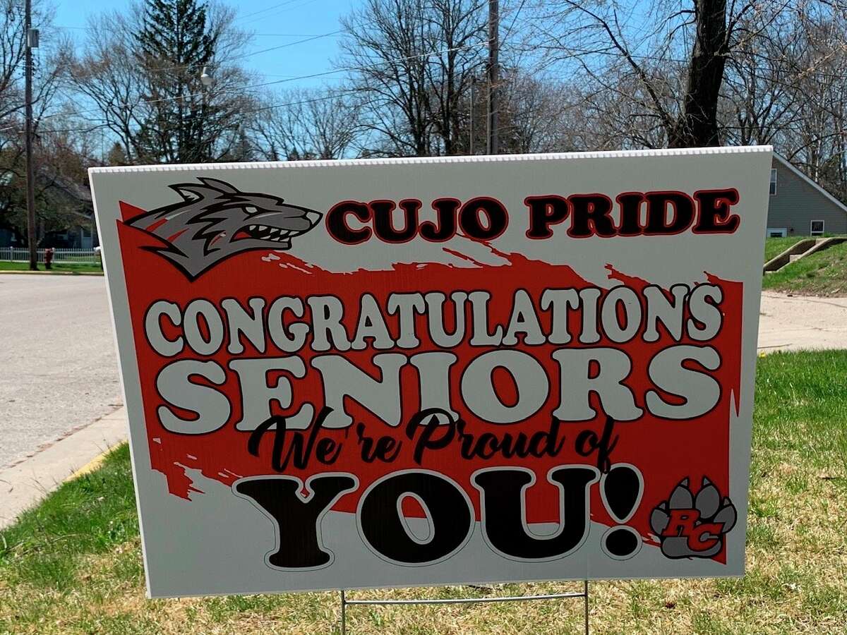 Seniors graduating from Reed City High School are honored by parents with yard signs congratulating them. Seniors are invited to join a "Senior Cruise" on May 15, to honor their graduation. (Pioneer photo/Cathie Crew)