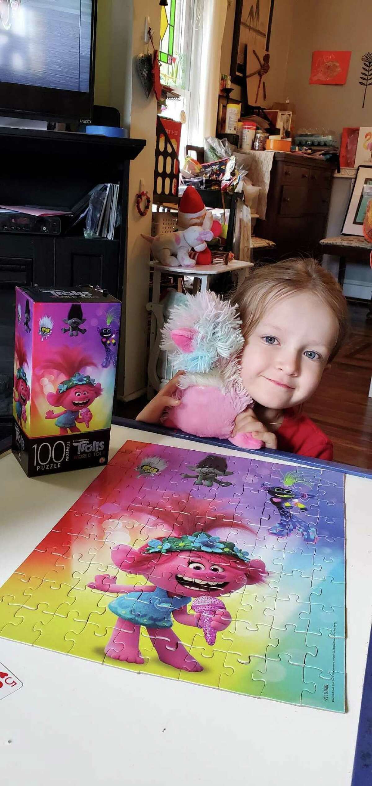 Noa Couture picked out a Trolls puzzle and a stuffed platypus from Cassetti’s toy stash.