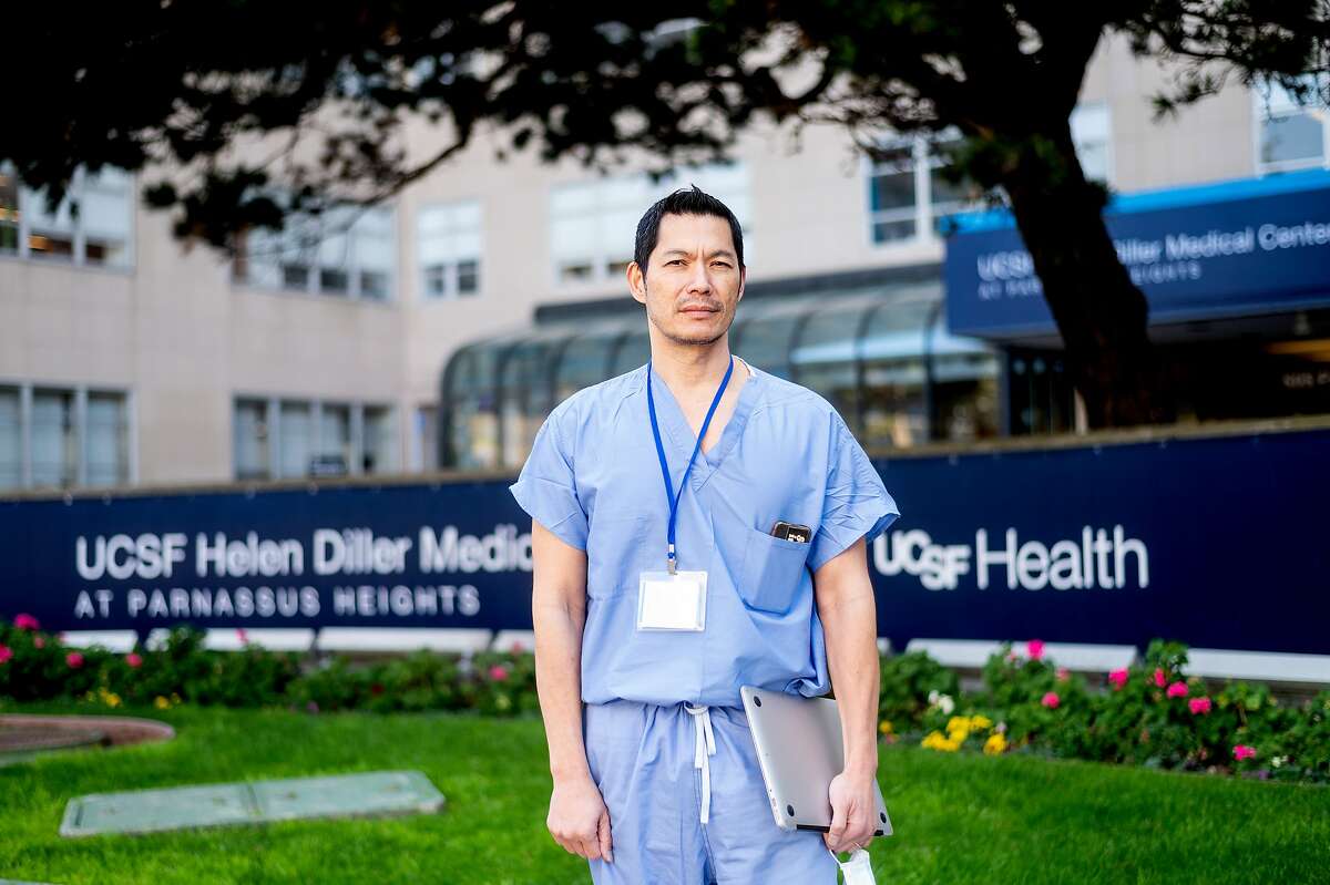 Dr. Peter Chin-Hong stands outside UCSF Medical Center on Friday, April 3, 2020, in San Francisco. Dr. Chin-Hong and fellow UCSF physicians are using Twitter to help educate the public about the frightening and evolving coronavirus outbreak.