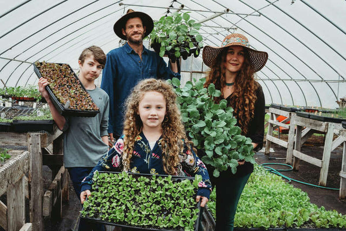 Gardener and author Crystal Stevens, right, with her husband and two children who work together on the family farm and business, FLOURISH, in Godfrey.