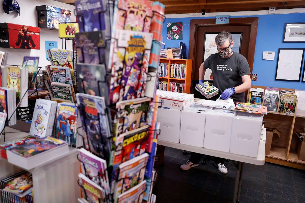 Brian Christensen, owner of Brian's Comics, packs up comics for mailing at his store in Petaluma, Calif., on Thursday, May 7, 2020. Christensen has been operating as an online only operation, but starting May 8th, Sonoma County non-essential businesses like florists, bookstores and clothing stores, will be able to offer curbside pick up.