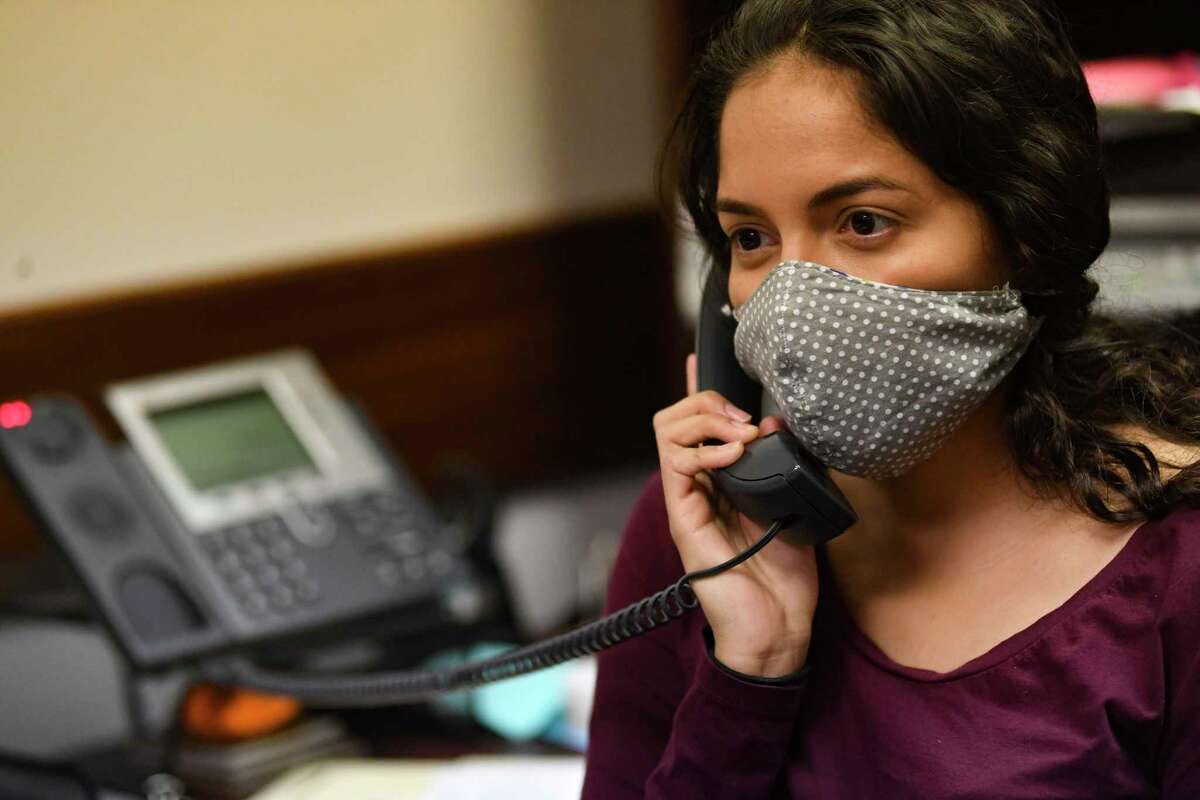 Andrea Valadez, who is completing her master’s degree in public health at the San Antonio campus of the UTHealth School of Public Health, has been volunteering as a contract tracer for the San Antonio Metro Health District. She works the phones on Thursday, May 7, 2020.