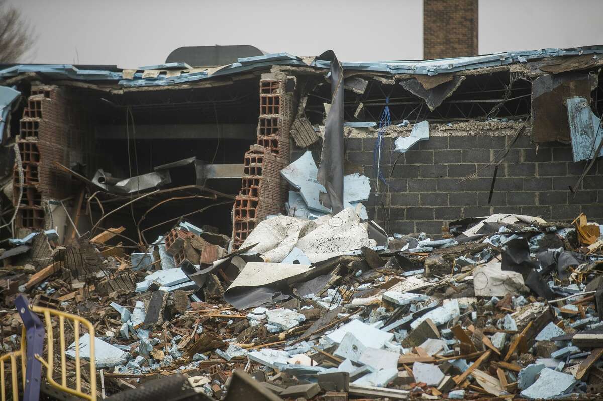 A construction crew works to demolish Eastlawn Elementary Friday, May 8, 2020 in Midland. (Katy Kildee/kkildee@mdn.net)