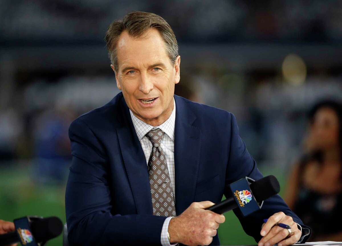 FILE - In this Oct. 30, 2016, file photo, NBC Sunday Night Football cast member Cris Collinsworth sits on the set during pregame of an NFL football game between the Philadelphia Eagles and the Dallas Cowboys in Arlington, Texas. NBCUniversal has announced an agreement with the NFL for NBC Sports to remain the home of Sunday Night Football until 2033.