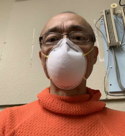 Dr. S. William Chang, an ophthalmologist with practice at Modesto, wears a mask in a photo he provided. He says some of his laid off workers are earning more in unemployment than they did while working.