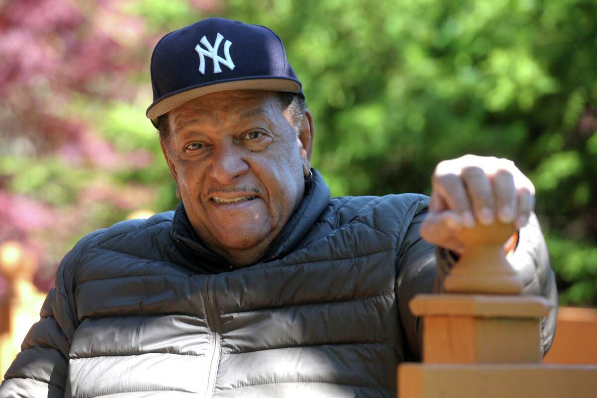 Rev. James Morton III of First Baptist Church, in Stratford, poses on the back porch of his Bridgeport, Conn. home May 6, 2020. Morton is recuperating at home after recently surviving COVID-19.
