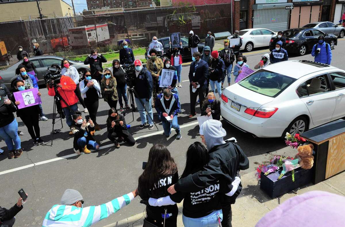 Jazmarie Melendez, sister of Jayson Negron, reads a statement to the media announcing a wrongful death lawsuit against the Bridgeport Police Department at the third anniversary of Jayson's death on Fairfield Ave in Bridgeport, Conn., on Saturday May 9, 2020. About 100 people gathered to protest Jayson's shooting on the third anniversary of his death.
