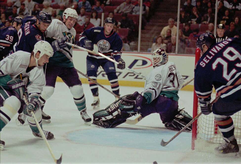 Edmonton Oilers right wing Alexander Selivanov, right, and the his teammates missed an opportunity for a goal in the first period against the Anaheim Mighty Ducks as goaltender Guy Hebert gets caught on the far side of the net Sunday, Nov. 7, 1999, in Anaheim, Calif.
