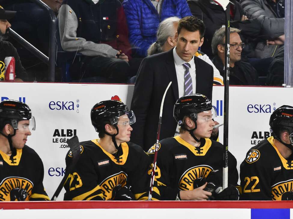LAVAL, QC - OCTOBER 16: Head coach of the Providence Bruins Jay Leach looks on from the bench against the Laval Rocket at Place Bell on October 16, 2019 in Laval, Canada. The Laval Rocket defeated the Providence Bruins 5-4 in a shoot-out. (Photo by Minas Panagiotakis/Getty Images)