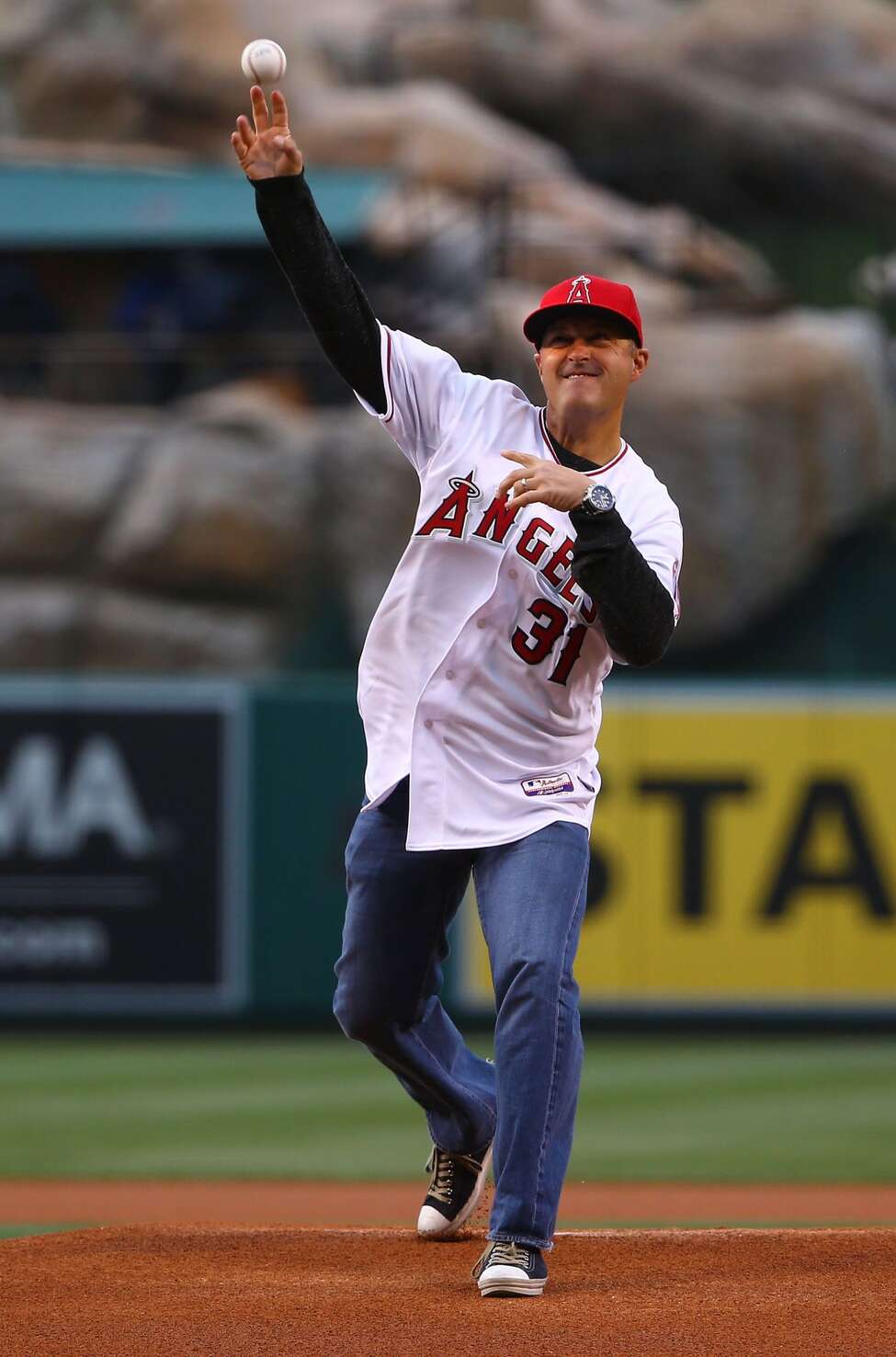 ANAHEIM, CA - MAY 07: Former Anaheim Mighty Ducks NHL player Guy Hebert throws out the ceremonial first pitch prior to the MLB game between the Houston Astros and the Los Angeles Angels of Anaheim at Angel Stadium of Anaheim on May 7, 2015 in Anaheim, California. Hebert, a Troy native, now works on the Ducks broadcast team. (Photo by Victor Decolongon/Getty Images)