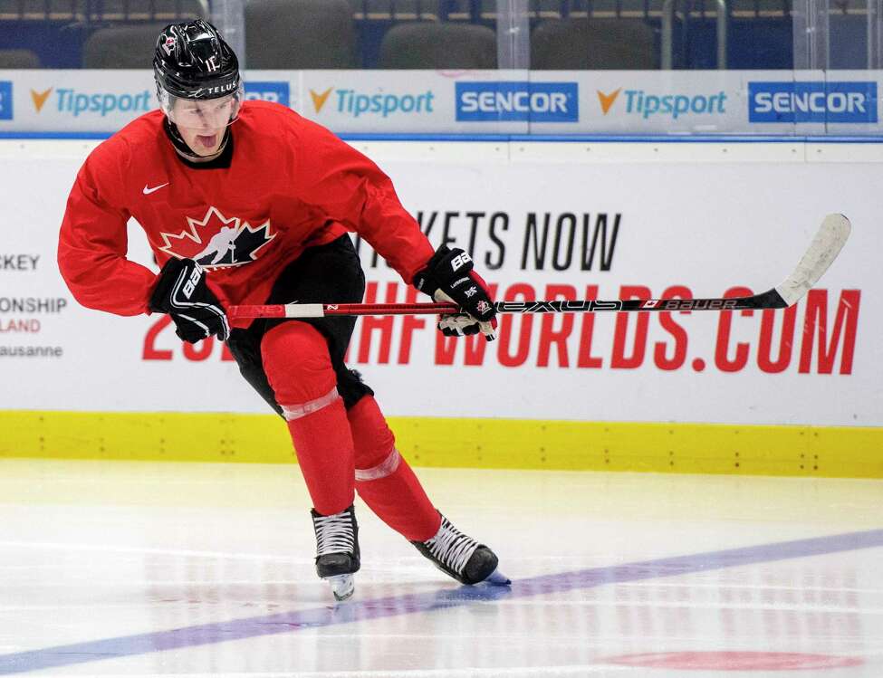 FILE - In this Jan. 1, 2020, file photo, Canada's Alexis Lafreniere during during practice at the World Junior Hockey Championships in Ostrava, Czech Republic. The Detroit Red Wings could actually benefit from an adjusted draft lottery that gives him better odds at the top pick, likely Alexis Lafreniere. (Ryan Remiorz/The Canadian Press via AP, FIle)