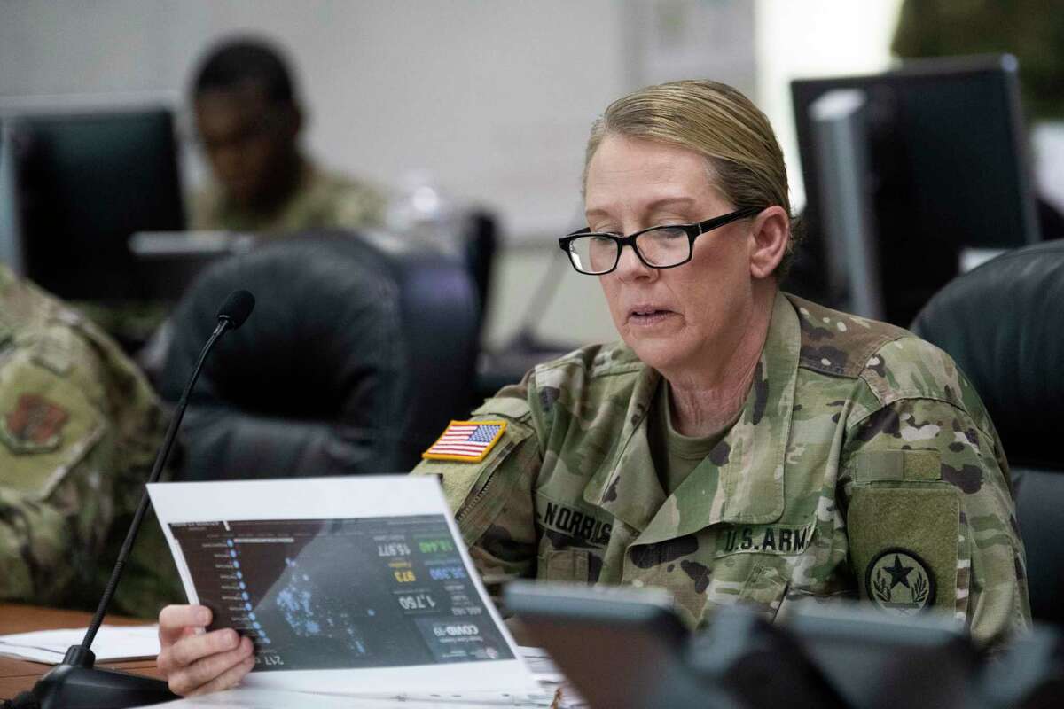 Maj. Gen. Tracy Norris, commander of the Texas National Guard gets a coronavirus briefing in May.
