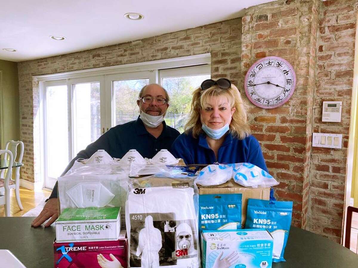 Marshall and Barby Marcus with some of the personal protective equipment they recently donated to Trumbull.