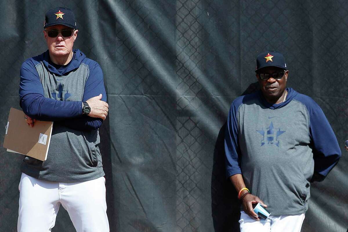 The world has changed since pitching coach Brent Strom, left, and manager Dusty Baker were getting their first glimpses of the 2020 Astros in February.