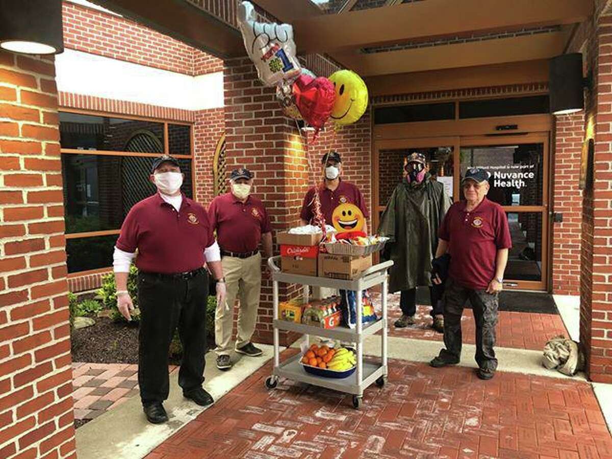 From left to right, Knights Community Director Walter Coffey, Program Director Frank Cavaliero, Gene Calarco, Deputy Grand Knight Francis Gorglione, and Grand Knight Frank Greco deliver food to New Milford Hospital.
