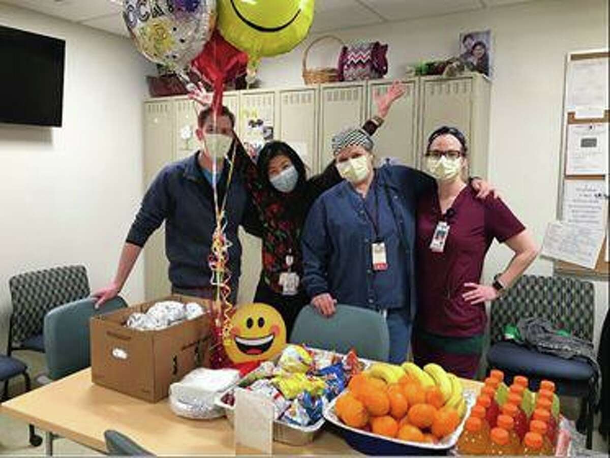 The Knights of Columbus Council 40 in New Milford recently participated in a goodwill mission for the men and women on the front lines battling coronavirus. Council members delivered a lunch for the entire staff at the New Milford Hospital Emergency Room the weekend of April 25. Above, ER staff acknowledges the donation during their lunch break.