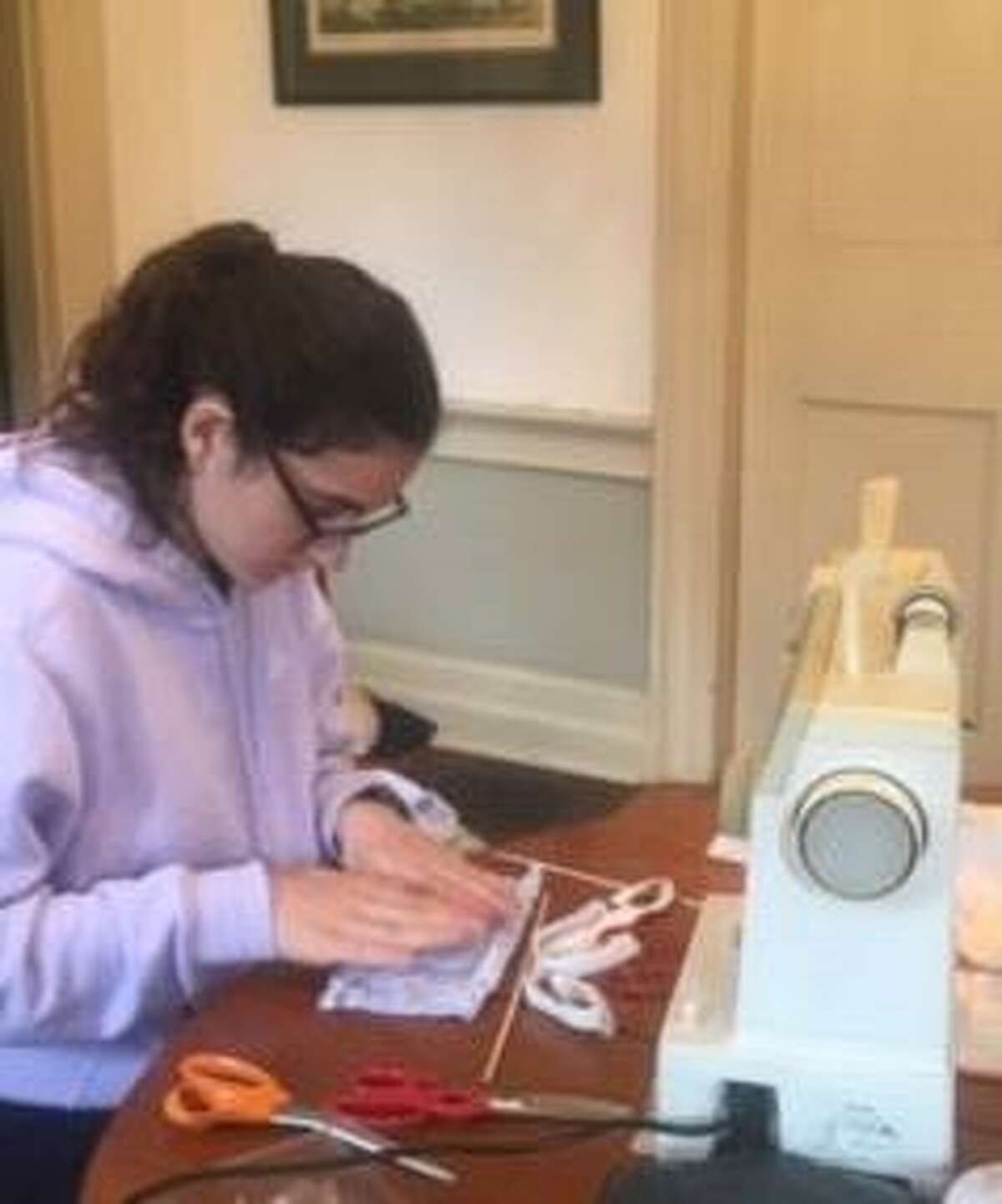 Students at the Devereux Glenholme School in Washington are making masks to help those on campus remain safe during the coronavirus pandemic. A target of 300 masks has been set. Glenholme is a coed therapeutic residential school for students 8-21 with social, emotional and learning challenges. Above is student Chloe B. To help with the effort, email CDELANEY@devereux.org.