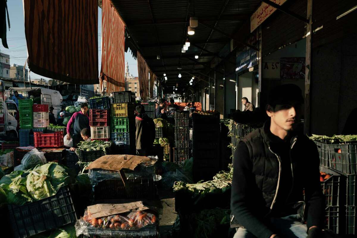 Traders at work in the main fruit and vegetable market Monday in Beirut. After an increase in the number of coronavirus cases in Lebanon, authorities have imposed a new four-day lockdown.