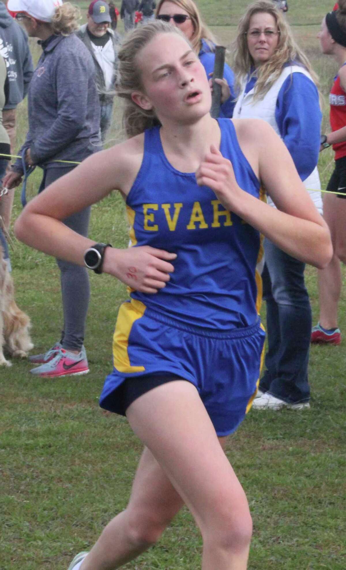 Evart's Sophia Scott gets close to the finish line of a cross country race last fall. (Herald Review file photo)